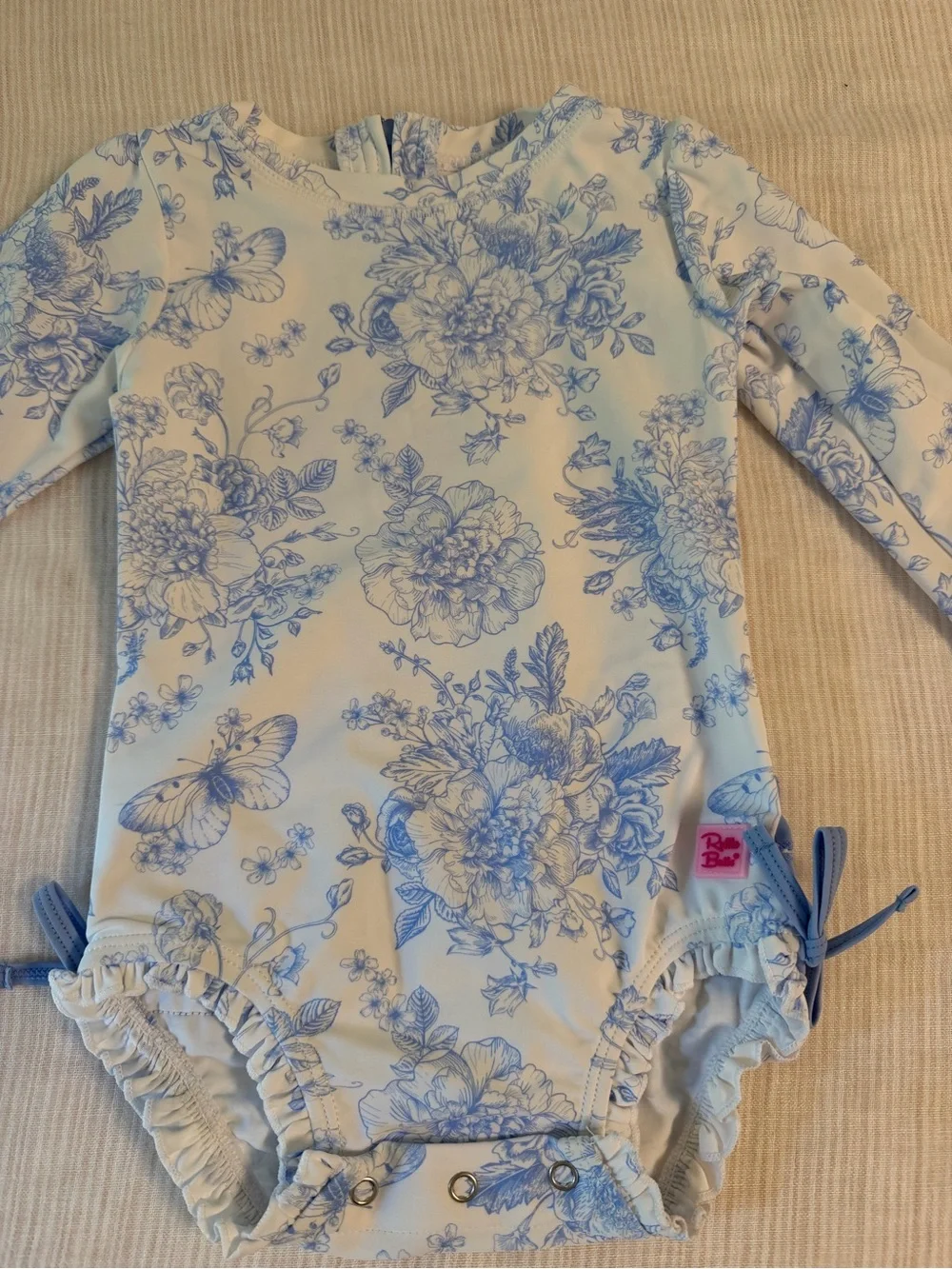 Ruffle Butts Blue and White Floral Long-Sleeve One-Piece Swimsuit